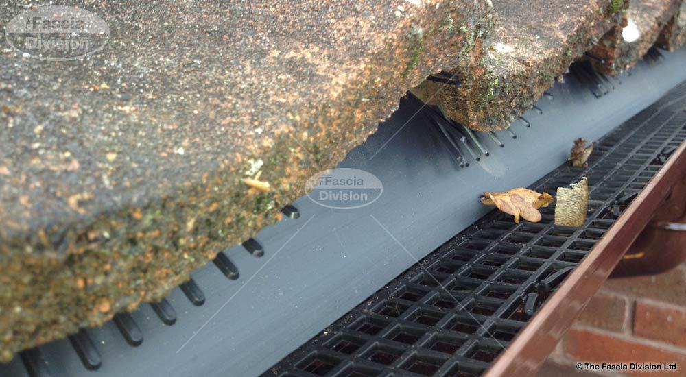 gutter guard fitted to brown ogee guttering