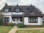 black fascia, soffits and guttering with black roof spires