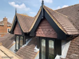 Black UPVC bargeboards with black GRP roof spires on Dormer windows