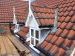 decorative bargeboards and roof spires on dormer windows