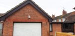 Rosewood fascia, white soffits on a garage gable