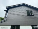 Rich Expresso Hardie Plank cladding on side of detached house