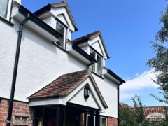 New white fascia, soffits and black guttering on dormer windows and porch