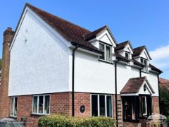 New white fascia, soffits and black guttering