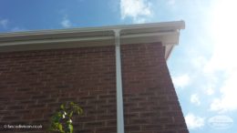 White fascia and guttering on detached house