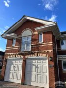 Front of house with decorative boxed eaves with dentil detailing