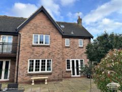 New black ash UPVC fascia and soffit on a detached house