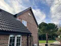 New black ash UPVC bargeboards and soffits on a gable end